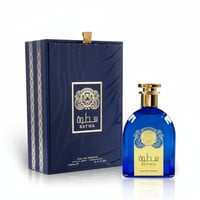 Ard Al Zaafaran Satwa — Blue glass perfume bottle with gold accents next to its matching navy blue box with gold trim.