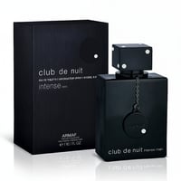 Armaf Club De Nuit Intense Man — Black perfume box and bottle with dice-shaped cap adorned with rhinestones, on a white