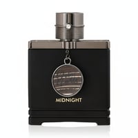Armaf Dubai Nights Midnight — Black perfume bottle with metallic cap and a circular wooden charm hanging from the neck.