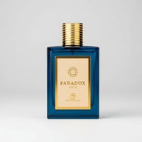 Grandeur Paradox Gold by Grandeur Elite 100 ml Man — A rectangular blue glass perfume bottle with a gold ribbed cap and a gold label featuring a circular emblem and the text 'PARADOX GOLD'.