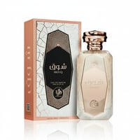 Al Wataniah Shouq Pink by Al Wataniah 100ml EDP Women — Kotak corak merah jambu dan putih bersama botol minyak wangi kaca berfaset dengan penutup emas ros, di latar belakang putih.