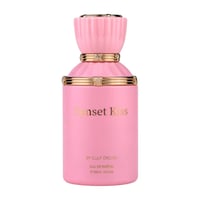 Gulf Orchid Sunset Kiss — Pink perfume bottle with gold accents and fluted cap, featuring "Sunset Kiss" text in gold.