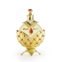 Khadlaj Hareem Al Sultan Gold by Khadlaj 35ml — Ornate gold perfume bottle with red gem accents and Arabic calligraphy, presented on a decorative gold stand.