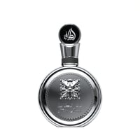Lattafa Fakhar Platin — Silver round perfume bottle with ornate emblem and Arabic script on white background