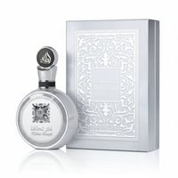 Lattafa Fakhar Platin — Silver round perfume bottle with ornate cap and embossed box with intricate pattern