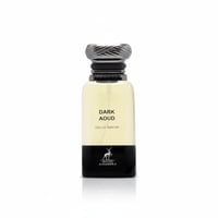 Maison Alhambra Dark Aoud — Clear glass perfume bottle with a black base, silver textured cap, and light yellow liquid. Features the brand logo and product name.