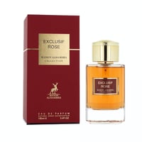 Maison Alhambra Exclusif Rose — A red box and a glass perfume bottle with gold accents and amber liquid, set against a white background.
