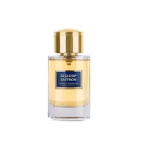 Maison Alhambra Exclusif Saffron — Clear glass perfume bottle with golden cap, showing golden liquid and a blue label with white text.