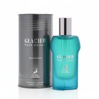 Maison Alhambra Glacier Pour Homme — Teal glass perfume bottle and matching grey cylindrical box with silver accents, both featuring gold deer logo and text.