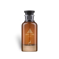 Maison Alhambra Jean Lowe Noir — Amber glass perfume bottle with a black cap, featuring gold leaf emblem and a deer silhouette.