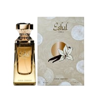 Paris Corner Eshal Vanilla by Paris Corner EDP 100ml — A tall, rectangular glass perfume bottle with golden liquid and a textured gold cap, placed next to its matching beige box featuring a vanilla flower illustration.