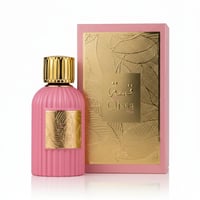 Paris Corner Qissa Pink by Paris Corner 100ml for Women — Pink fluted perfume bottle with gold cap and gold label, next to a pink box with gold leaf pattern and "Qissa Pink" text.
