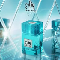 Zimaya Mazaaj Rhythm by Zimaya 100 ml EDP Unisex — A clear turquoise glass perfume bottle with a white label featuring Arabic script and 'MAZAAJ rhythm' in English, set against a reflective, diamond-patterned blue background with other bottles visible in the reflection.