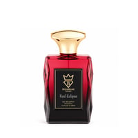 Bujairami Red Eclipse — Red faceted glass perfume bottle with a gold cap, black label with gold crown and text.