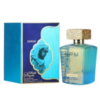 Lattafa Sheikh Al Shuyukh Supreme by Lattafa 100ml — A blue and teal gradient perfume bottle with a textured gold cap sits next to its matching blue and teal box featuring an illustration of a man in traditional headwear. | Lattafa Sheikh Al Shuyukh Supreme by Lattafa 100ml — Botol minyak wangi gradien biru dan teal