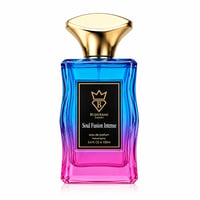 Bujairami Soul Fusion Intense — A gradient glass perfume bottle with blue fading to pink, topped with a gold cap, featuring a black label with gold text and a crown logo.