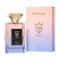 Bujairami Sugar Rush Eau de Parfum 100ml — Clear faceted glass bottle with pink to blue gradient liquid, gold cap, and black label with gold crown logo. Box with matching gradient and logo.