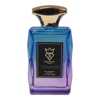 Bujairami Unforgettable Eau de Parfum — A rectangular glass perfume bottle with a gradient blue to purple color, a gold cap, and a black label featuring a crown logo and the text 'Unforgettable'.