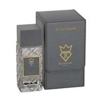 Bujairami World Power Oud Cacao Leather 100ml Extrait — Clear faceted glass perfume bottle with grey cap next to a grey presentation box with gold embossed logo and text