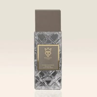 Bujairami World Power Oud Cacao Leather 100ml Extrait — Clear faceted glass bottle with a grey cap and a gold label featuring a crown and 'B' logo, text reads 'EXTRACT DE PARFUM NATURAL SPRAY 3.4 FL. OZ. 100ml'