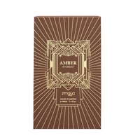 Zimaya Amber Is Great Eau De Parfum 100ml — A brown box with gold geometric patterns and sunburst lines, featuring the text "AMBER IS GREAT" in a central ornate frame, and "zimaya" logo below. | Zimaya Amber Is Great Eau De Parfum 100ml — Peti coklat dengan corak geometri emas dan garisan pancaran matahari