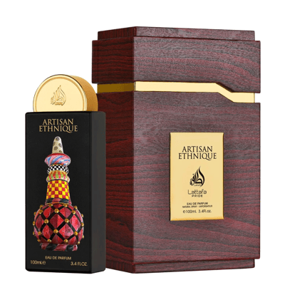 Lattafa Pride Artisan Ethnique — Black perfume bottle with ornate colorful cap and decorative base, next to a wooden presentation box with gold accents.