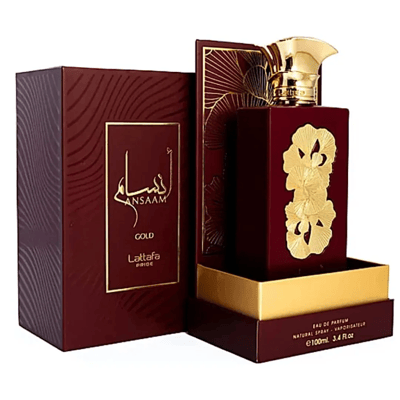 Lattafa Pride Ansaam Gold — Maroon box with gold wavy pattern and gold framed label, alongside a maroon perfume bottle with gold floral embellishments and a gold cap, presented in a gold and maroon display stand.