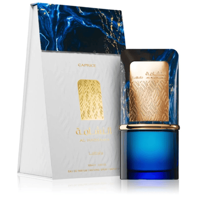 Lattafa Al Nashama Caprice — Blue glass perfume bottle with ornate gold and blue cap next to its white and blue marble