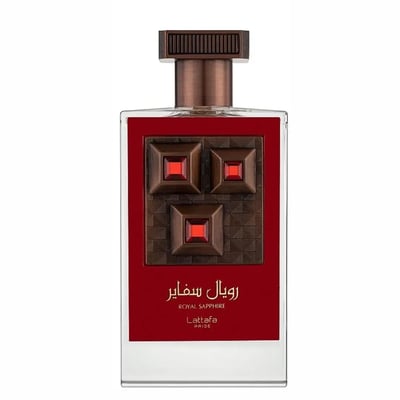 Lattafa Pride Sapphire Royal — Clear glass perfume bottle with a red label featuring a textured brown square with three inset red gems and gold accents. The cap is ribbed and bronze-colored.