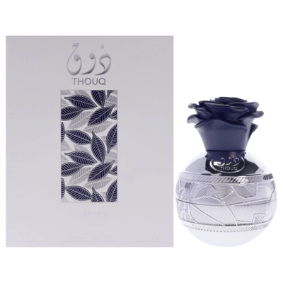 Lattafa Pride Thouq — White box with blue leaf pattern next to a silver perfume bottle with a blue rose cap.