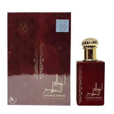 Ard Al Zaafaran Ahlam Al Khaleej 80ml — A maroon perfume box with gold intricate patterns and Arabic calligraphy is shown next to a matching maroon perfume bottle with a gold ribbed cap. | Ard Al Zaafaran Ahlam Al Khaleej 80ml — Kotak minyak wangi berwarna merah marun dengan corak rumit emas dan kaligrafi Arab