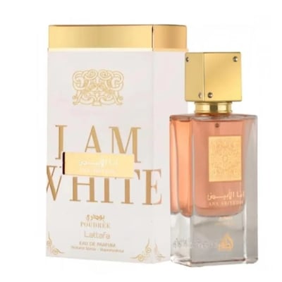 Lattafa Ana Abiyedh Poudree — A white perfume box with gold accents and Arabic script stands next to a clear glass perfume bottle with a rose-gold liquid and a gold cap. | Kotak minyak wangi putih Lattafa Ana Abiyedh Poudree dengan aksen emas dan tulisan Arab berdiri di sebelah botol minyak wangi kaca jernih dengan