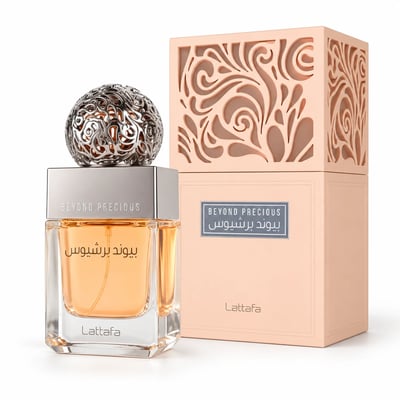 Lattafa Beyond Precious by Lattafa 100ml EDP Women — A square glass perfume bottle with orange liquid and a decorative silver spherical cap, next to its peach-colored box with intricate cutouts.