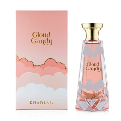 Khadlaj Cloud Candy Eau De Parfum 100ml — A pink and white box with cloud motifs and gold lettering sits next to a clear glass perfume bottle with similar cloud designs and a gold cap. | Khadlaj Cloud Candy Eau De Parfum 100ml — Sebuah kotak merah jambu dan putih dengan motif awan dan tulisan emas diletakkan di