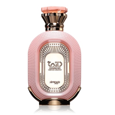 Zimaya Daiman Eden Eau De Parfum 100ml by Zimaya — A pink oval perfume bottle with a textured surface, gold accents, and a faceted pink and gold cap, set against a white background with a subtle reflection. | Zimaya Daiman Eden Eau De Parfum 100ml by Zimaya — Botol minyak wangi bujur merah jambu dengan permukaan