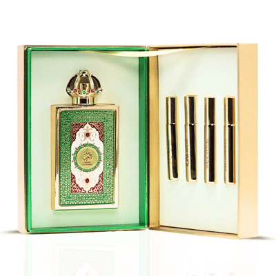 Lattafa Pride Queen Of Arabia by Lattafa Pride 100ml EDP — Luxurious green and gold perfume set featuring a large ornate bottle with a crown cap and four smaller golden travel spray vials in an open gift box.