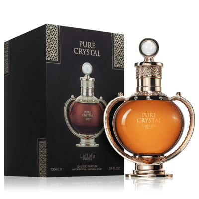 Lattafa Pride Pure Crystal — Black box with gold geometric pattern and a perfume bottle with a brown-amber liquid, displayed next to its matching ornate gold-accented bottle.