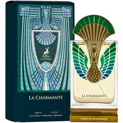 Maison Alhambra La Charmante — A bottle of La Charmante perfume with a peacock-inspired gold and green cap, next to its matching dark teal box with art deco design.