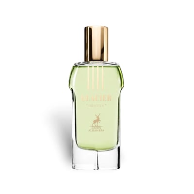 Maison Alhambra Glacier Heaven 100ml — A clear glass perfume bottle with light green liquid and a gold cap, featuring gold text and a deer logo on the label. | Maison Alhambra Glacier Heaven 100ml — Botol kaca jernih dengan cecair hijau muda dan penutup emas, menampilkan teks emas dan logo rusa pada label.