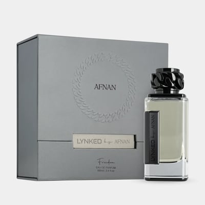Afnan Lynked Freedom by Afnan Eau De Parfum — Grey gift box with embossed circular pattern and ribbon detail, next to a clear glass perfume bottle with a black chain-link cap and black label.