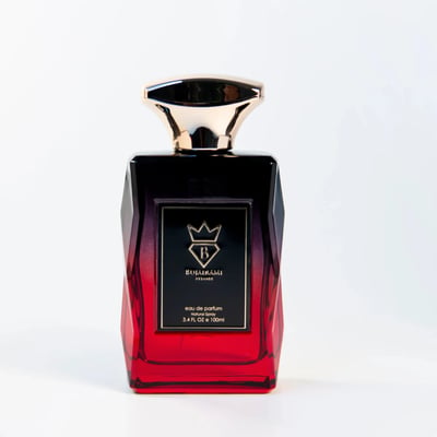 Bujairami Madness by Bujairami 100ml EDP — A faceted glass perfume bottle with a gradient from black to red, featuring a gold cap and a black label with gold text and a crown logo.