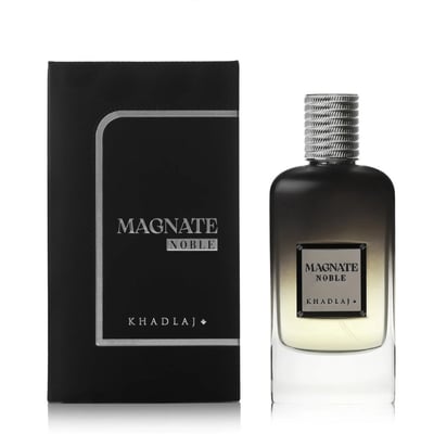 Khadlaj Magnate Noble — A black textured box stands to the left of a clear glass perfume bottle with a gradient dark to light brown finish and a silver textured cap. The bottle contains light yellow liquid. | Khadlaj Magnate Noble — Kotak hitam bertekstur berdiri di sebelah kiri botol minyak wangi kaca jernih dengan