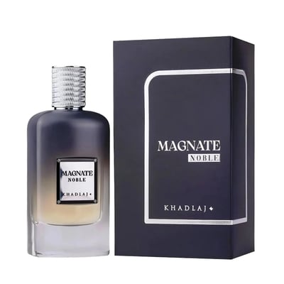 Khadlaj Magnate Noble — A dark grey gradient perfume bottle with a silver textured cap sits next to its matching dark navy box with silver trim. | Khadlaj Magnate Noble — Botol minyak wangi kelabu gradien gelap dengan penutup bertekstur perak terletak di sebelah kotak biru laut gelap yang sepadan dengan trim perak.