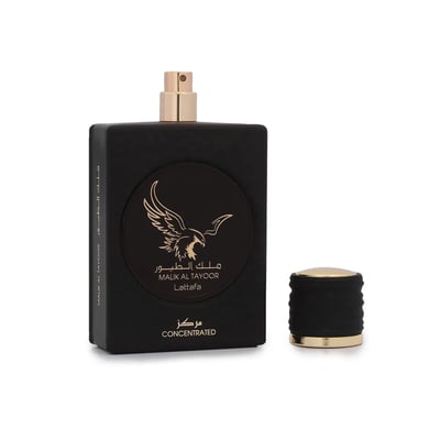 Lattafa Malik Al Tayoor Concentrated — Black perfume bottle with gold accents and an eagle logo, next to its detached gold and black cap on a white background | Lattafa Malik Al Tayoor Concentrated — Botol minyak wangi hitam dengan aksen emas dan logo helang, bersebelahan dengan penutup emas dan hitamnya yang