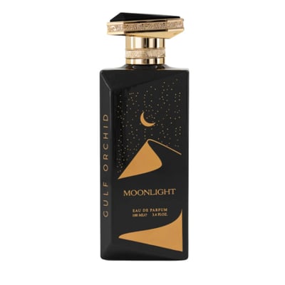 Gulf Orchid Moonlight Eau De Parfum — Black perfume bottle with gold desert dunes and crescent moon design, gold cap with black stone accent | Gulf Orchid Moonlight Eau De Parfum — Botol minyak wangi hitam dengan reka bentuk bukit pasir emas dan bulan sabit, penutup emas dengan aksen batu hitam