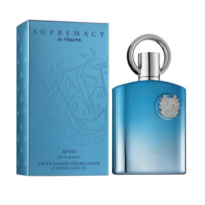 Afnan Supremacy In Heaven — Blue gradient perfume bottle with silver ring cap next to matching blue box with embossed crest