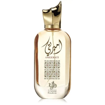 Al Wataniah Ameerati — Clear glass perfume bottle with gold cap and Arabic calligraphy on a white background.