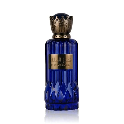 Al Wataniah Kenz Al Malik – Blue faceted glass perfume bottle with ornate gold crown-like cap and gold label