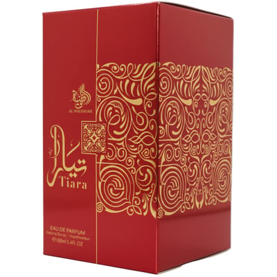 Al Wataniah Tiara — Red perfume box with gold ornate scrollwork and Arabic calligraphy.