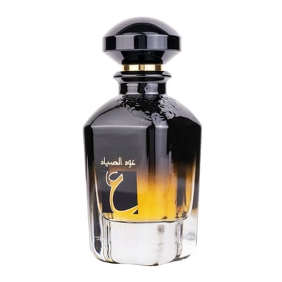 Ard Al Zaafaran Oud Al Sayad — Black and gold gradient glass perfume bottle with Arabic script and a black cap.